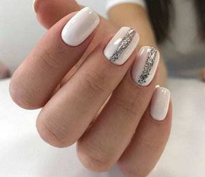 White manicure with glitter