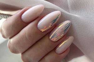 White manicure with rubbing on nails. Photo 