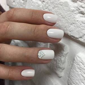 White manicure with rhinestones 2021