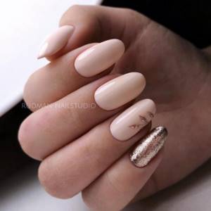 beige golden manicure with patterns and designs