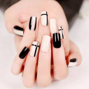Black white manicure with silver on square nails.