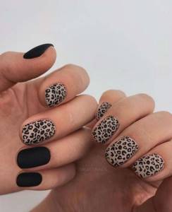 Black manicure with leopard print