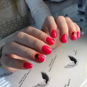 red and black nail design with pattern