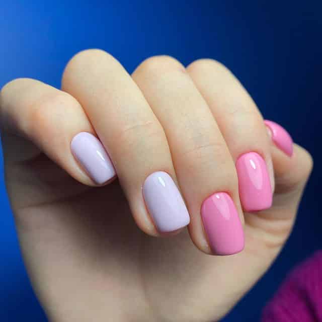 Two-tone glossy pink and lilac manicure
