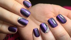 Purple manicure for short nails with rhinestones