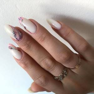 Purple manicure on a milky background