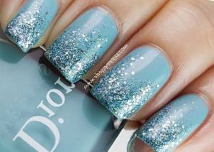 blue manicure with glitter