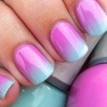 Gradient manicure with gel polish in pink and blue tones