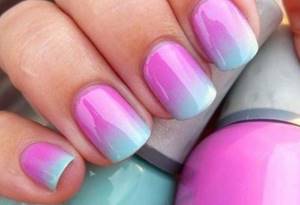 Gradient manicure with gel polish in pink and blue tones
