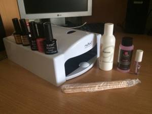 Tools and materials for colored French manicure with gel polish.