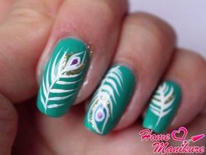 interesting peacock feather on nails