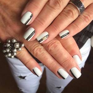 Interesting black and white manicure design in the photo