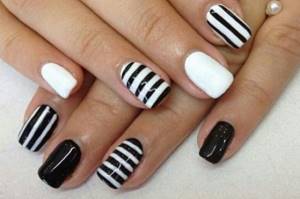 Classic black and white nail design with stripes
