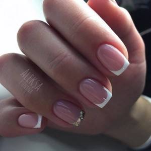 A beautiful bride&#39;s French manicure for short, square-shaped nails.