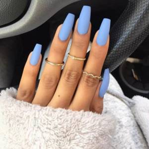 Beautiful blue matte manicure on long square nails.