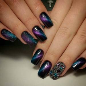 Beautiful manicure with cat eye rhinestones and transparent acrylic painting.