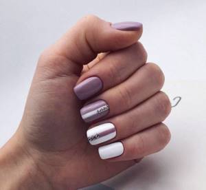 Beautiful manicure in white combined with lilac, accented with rhinestones.