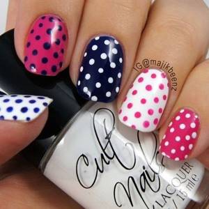Red and blue manicure with polka dots