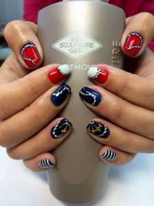 Red and blue manicure with a marine theme