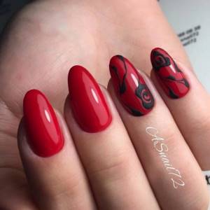 red nail design with black and pattern