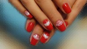 Red lace manicure with pearl and rhinestone decor