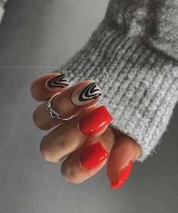 Red manicure zebra design