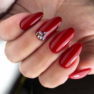Red manicure on extended nails