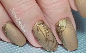 Lacy patterns and openwork monograms with gold for manicure