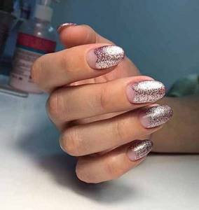 Lunar manicure with pink sparkles