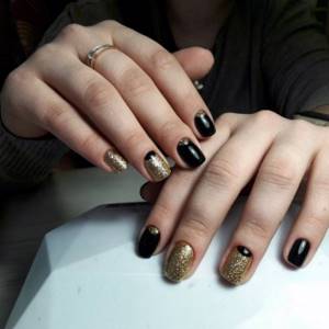Lunar manicure in the style of gold precious metals