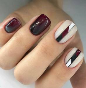 Burgundy manicure for short square nails with a beautiful design.