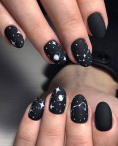 Matte black manicure with stars