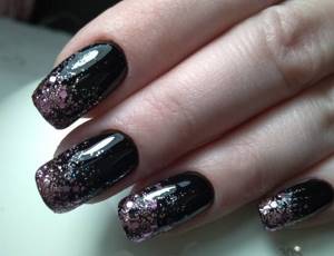 Black manicure with glitter. Matte photo with gold, red, pink 