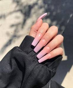 Manicure for long square nails in beige color.