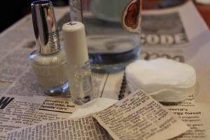 Manicure with newspaper text - necessary supplies