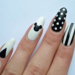 Manicure with Mickey Mouse, stripes and polka dots black and white