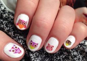 Manicure with owls using stickers