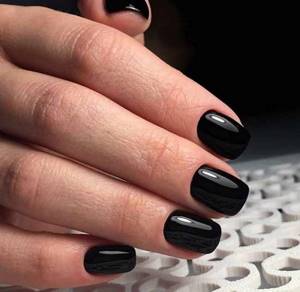 Fashionable manicure in one black color