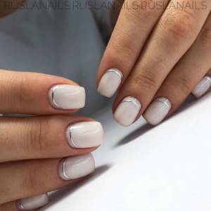 Milky manicure with silver ribbon