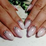 Milky manicure with rhinestones