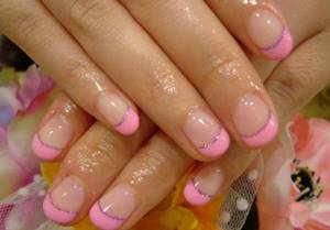 Gently pink manicure with gel polish with glitter, rubbing, rhinestones, silver, black, white, blue, gold. Photo 