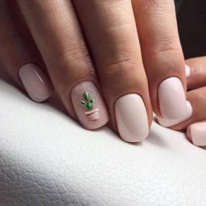 Delicate milky color on short square nails. Interesting cactus design on the ring finger. 