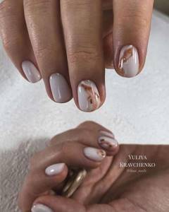 Delicate milky manicure with foil