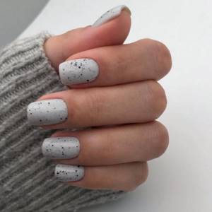 Quail manicure in gray tones