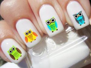 An example of a manicure with owls on rectangular extended nails