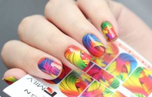 Multi-colored abstract slides on nails