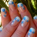 Drawing flowers on nails.