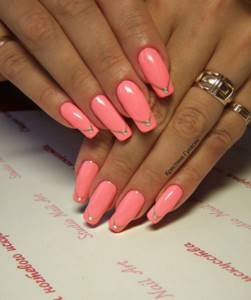 Pink glossy gel polish with rhinestones on each nail.