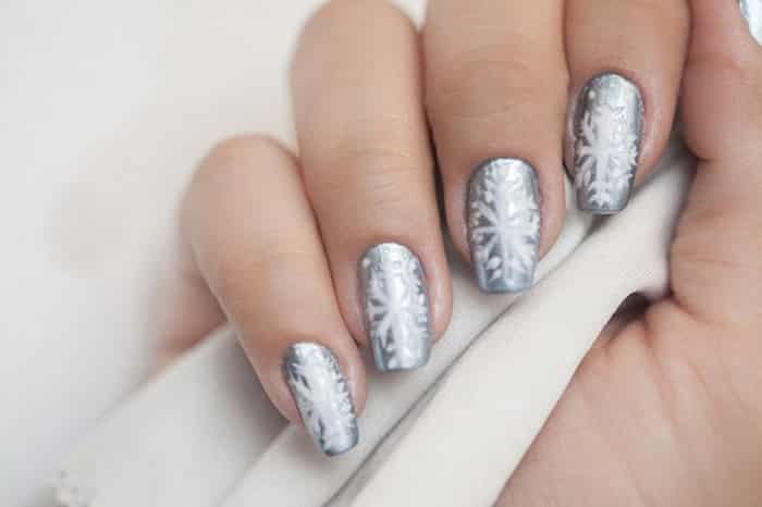 Silver on nails with snowflakes