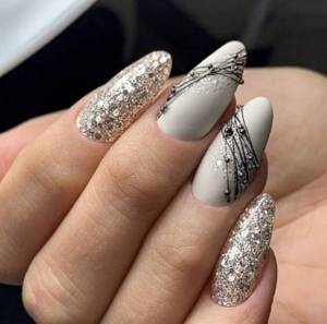 Gray manicure with sparkles and rhinestones